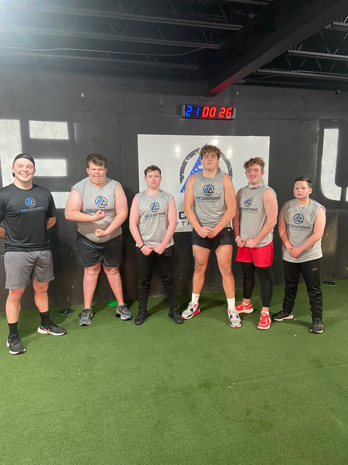 Coach Jaren Strader working out with teens
